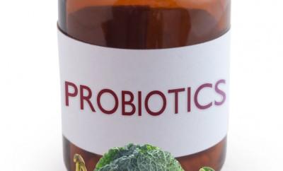 Bottle of probiotic supplements and healthy foods