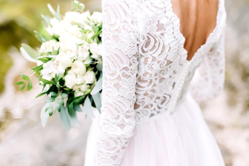 Back view of bride's lace wedding dress