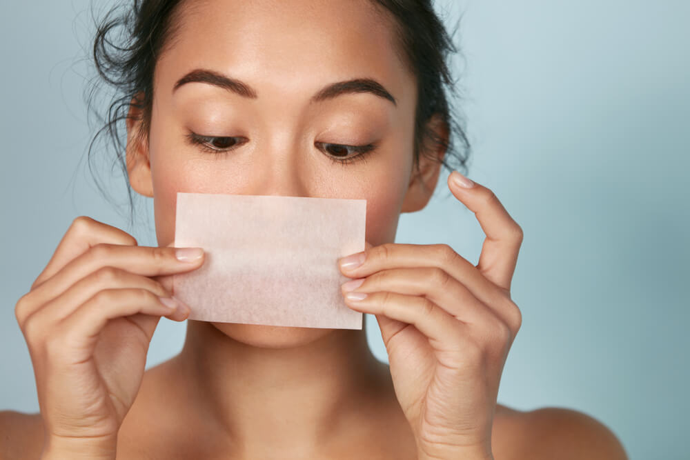 woman blotting papers