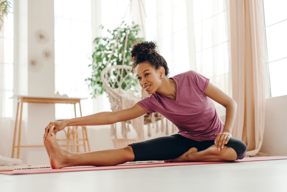 Woman stretching as a biohacking habit