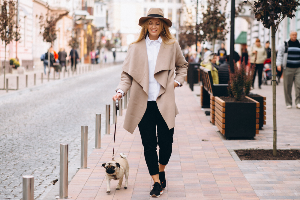 Woman walking dog and doing yoga